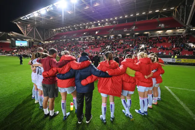 Players of Arsenal form a huddle