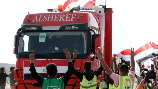 A truck carrying humanitarian aid for the Gaza Strip crosses the Rafah border gate, in Rafah, Egypt, 22 October 2023.