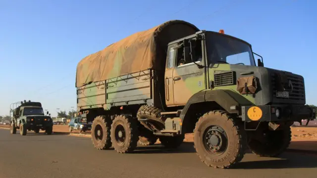 A convoy of French troops based in Niger drives by as they prepare to leave Niger, in Niamey, Niger October 22, 2023.