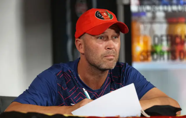 Afghanistan coach Jonathan Trott writes a note