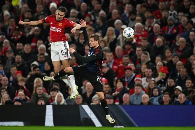 Manchester United's Spanish defender Sergio Regulion fights for the ball