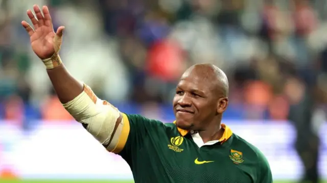 South Africa's hooker Bongi Mbonambi waves to the crowd as he celebrates his team's victory in the France 2023 Rugby World Cup quarter-final match against France at the Stade de France in Saint-Denis, on the outskirts of Paris, on October 15, 2023.