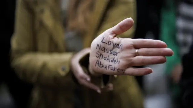 An attendee displays names of killed children on her palm at an event organised by Medical Aid for Palestinians non-profit organisation at Parliament Square in London, Britain, 24 October 2023.