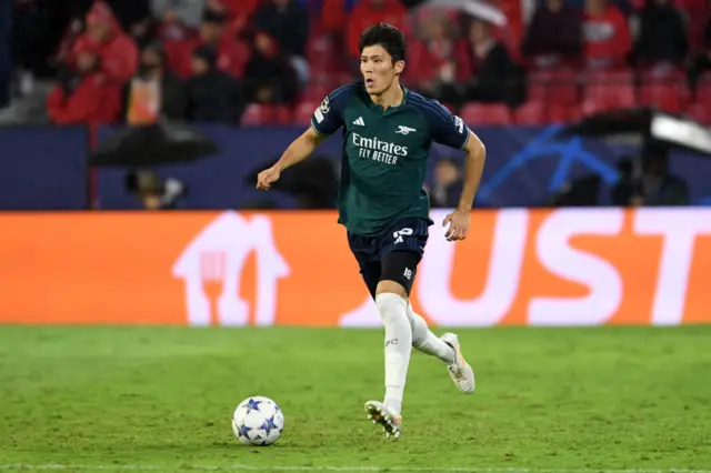 Takehiro Tomiyasu of Arsenal runs with the ball