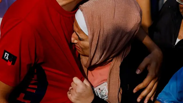 A Palestinian woman reacts as she attends a funeral of Palestinians killed in Israeli strikes, amid the ongoing conflict between Israel and Palestinian Islamist group Hamas, in Khan Younis in the southern Gaza Strip, October 24, 2023.