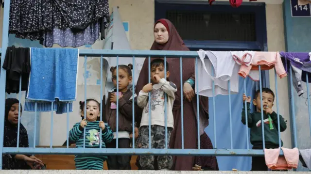 Children seen on a balcony in Khan Yunis on Tuesday