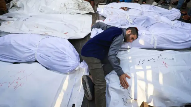 A man mourns as he attends a funeral of Palestinians killed in Israeli strikes, amid the ongoing conflict between Israel and Palestinian Islamist group Hamas, in Khan Younis in the southern Gaza Strip, October 24, 2023.