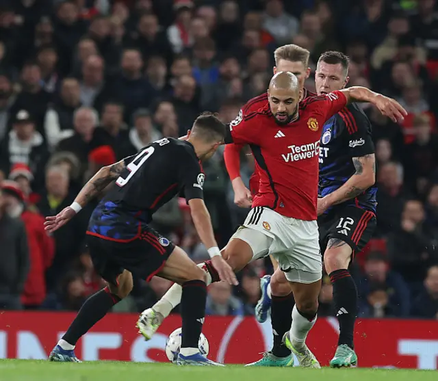 : Sofyan Amrabat of Manchester United in action with Diogo Goncalves