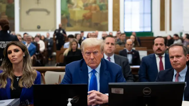 Former US President Donald J. Trump (C) sits with his attorneys in the courtroom as he attends his civil fraud trial in New York, New York, USA, 24 October 2023.