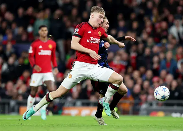 Rasmus Hojlund of Manchester United is challenged by Rasmus Falk