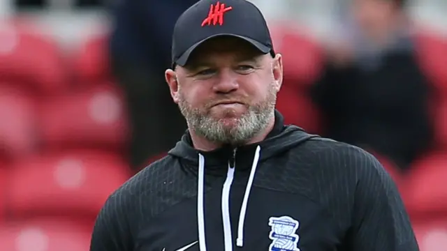 Wayne Rooney stands on the sidelines for his first game as Birmingham boss