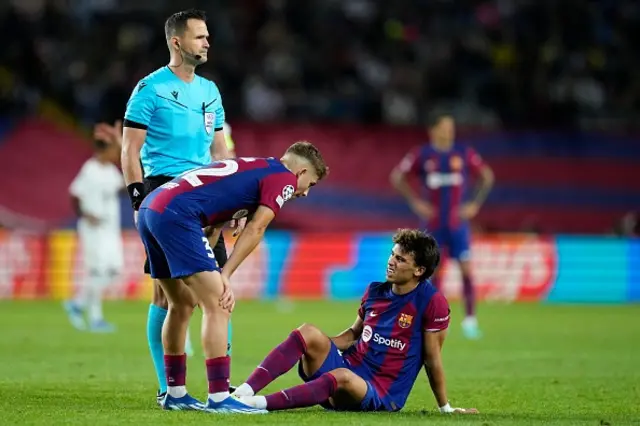 Ferran torres stands over Joao Felix