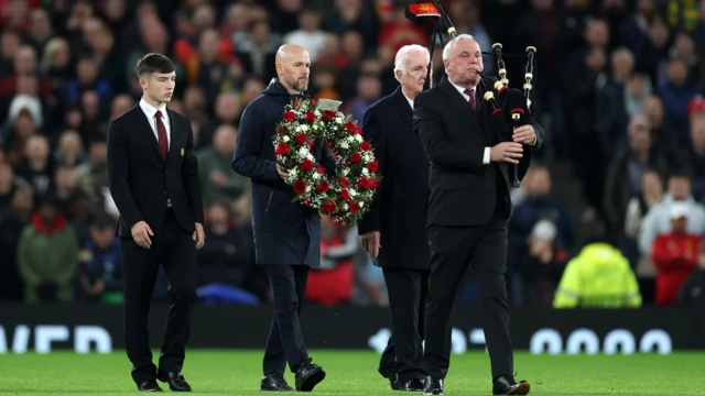 Erik ten Hag, manager of Manchester United, lays a wreath in tribute to former player Sir Bobby Charlton