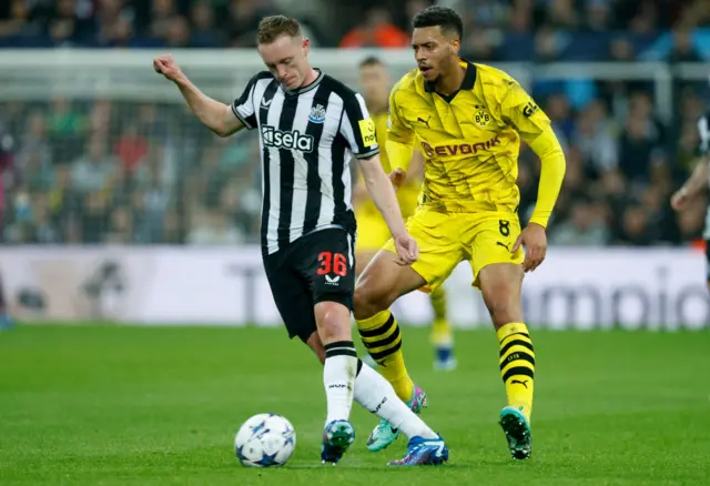 Sean Longstaff passes the ball