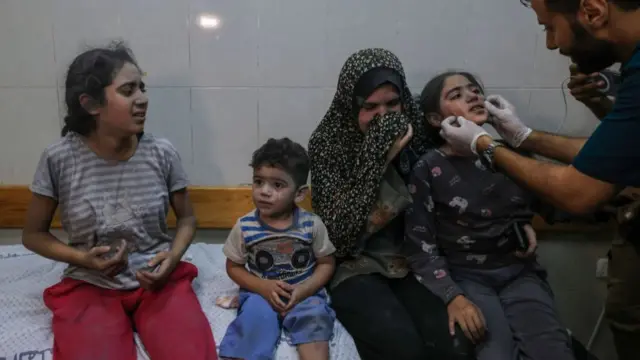 A family receives treatment at a hospital in Khan Younis