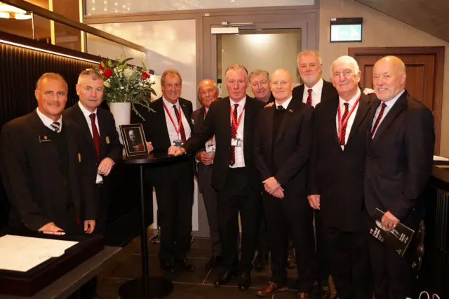 Former Manchester United players gather to sign the book of condolences for Sir Bobby Charlton