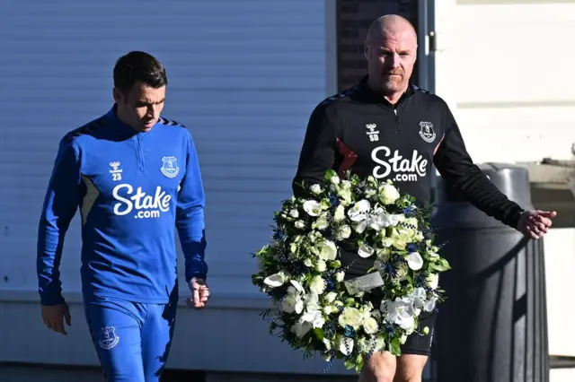 Everton defender Seamus Coleman and manager Sean Dyche with a wreath for Bill Kenwright