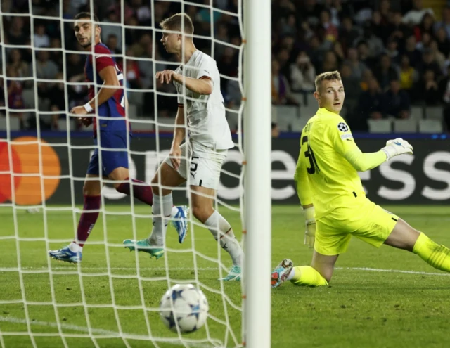 Ferran Torres watches on as the ball crosses the line