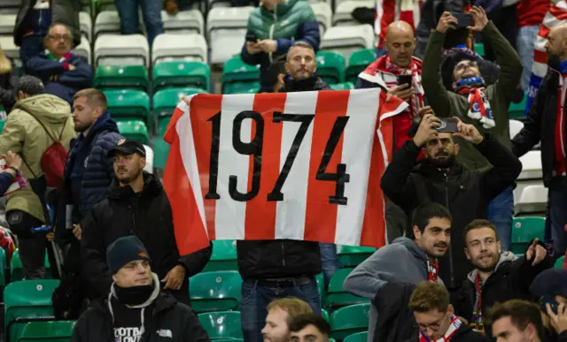 Atletico fan holding 1974 flag