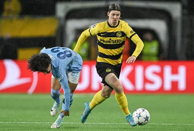 Cedric Itten  runs with the ball past Manchester City's English defender Rico Lewis