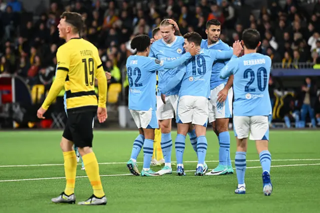 Erling Haaland of Manchester City celebrates with teammates