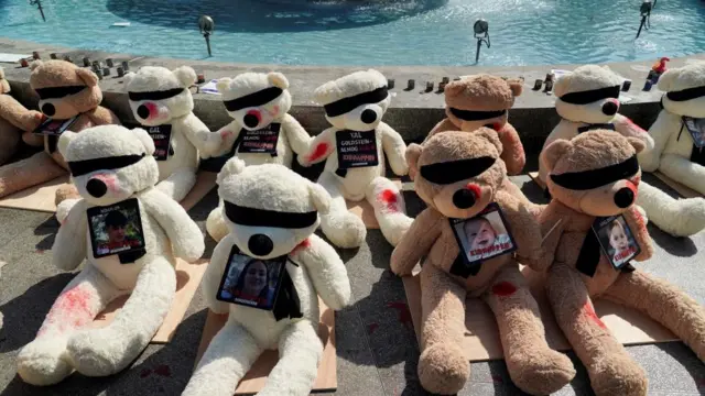 Teddy bears carrying the names and pictures of Israeli children held hostage by Hamas in Gaza are displayed at Dizengoff Square in Tel Aviv