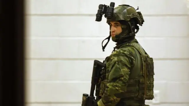 An armed police officer in Lewiston