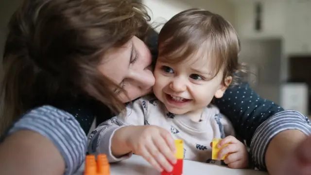 Mother hugging child