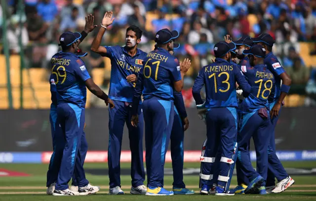 Kasun Rajitha of Sri Lanka celebrates the wicket of Jonny Bairstow of England during the ICC Men's Cricket World Cup India 2023 between England and Sri Lanka at M. Chinnaswamy Stadium