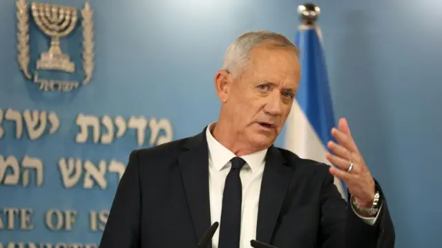 Benny Gantz speaking, gestures with hand