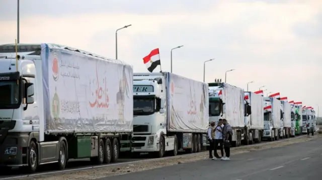 Trucks carrying humanitarian aid bound for the Gaza Strip wait to pass through the Rafah border crossing, Egypt, 24 October 2023.