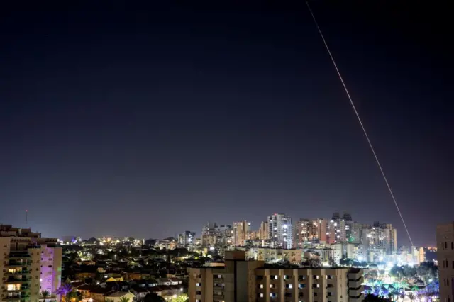 A rocket being fired at central Israel from Gaza on Wednesday night, as seen from Ashkelon in Israel