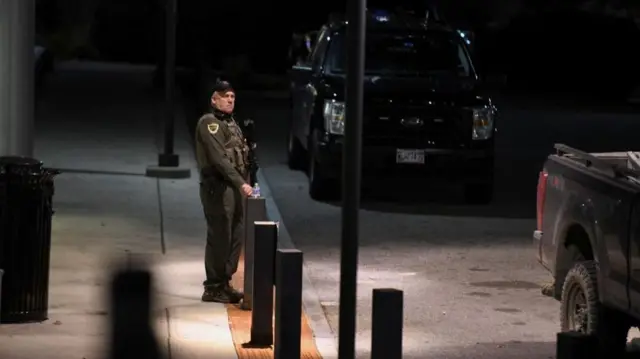 Armed police officer outside a hospital