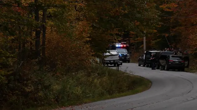 Law enforcement members work as an active search for a gunman is underway, following a deadly mass shooting in Lewiston, in Bowdoin, Maine, U.S. October 26, 2023.