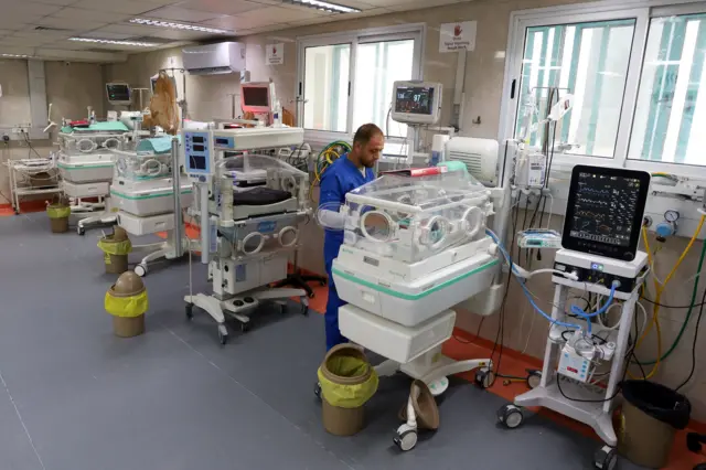 A medical worker looks after babies in incubators at the Al-Shifa Hospital in Gaza