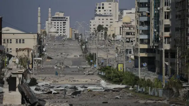 Debris in a deserted street following Israeli air strikes in Gaza City on 26 October 2023