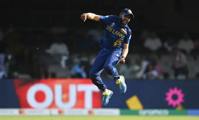 Sadeera Samarawickrama of Sri Lanka celebrates the wicket of Chris Woakes of England during the ICC Men's Cricket World Cup India 2023 between England and Sri Lanka