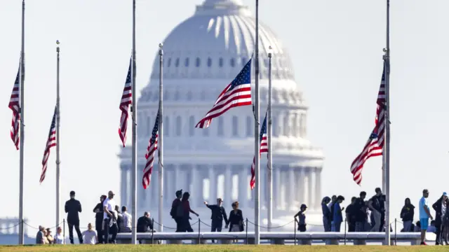 Flags fly at half-staff on the National Mall to honour victims of the October 25 mass-shooting in Lewiston Maine