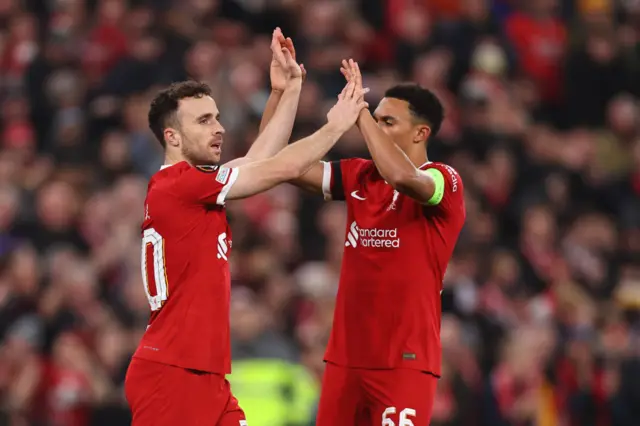 Diogo Jota celebrates with Trent Alexander-Arnold