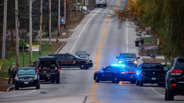 Police vehicles in the middle of the road