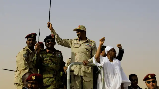 Lieutenant General Mohamed Hamdan Dagalo, deputy head of the military council and head of paramilitary Rapid Support Forces (RSF), greets his supporters as he arrives at a meeting in Aprag village, 60 kilometers away from Khartoum, Sudan, June 22, 2019