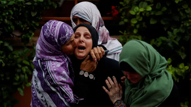 Relatives of people killed during the conflict in Gaza escalation mourn their deaths at the Nasser Hospital in Khan Younis