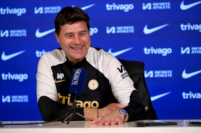 Mauricio Pochettino laughs during his news conference on Friday