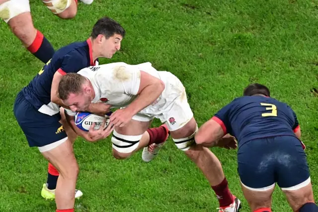 England's openside flanker Sam Underhill attempts to break away