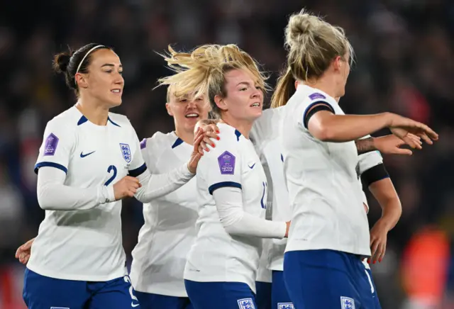 Lauren Hemp of England celebrates with teammates