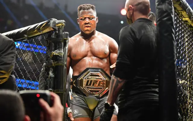 Francis Ngannou leaves the octagon after beating Ciryl Gane in January 2022