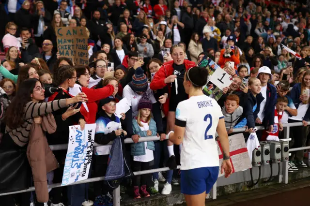 Bronze walks over to waiting fans at full time.