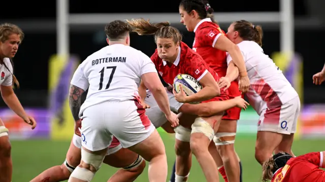 Canada carry the ball against England