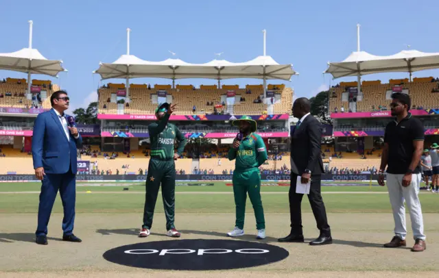 Pakistan captain Babar Azam tosses the coin alongside South Africa captain Temba Bavuma