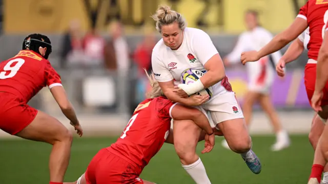 Marlie Packer carries the ball for England